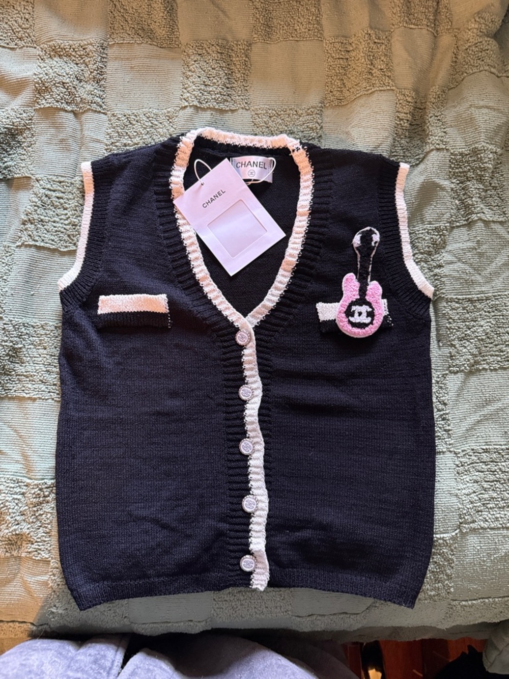 CHANEL Black Knit Vest with Pink Trim and Logo Charm